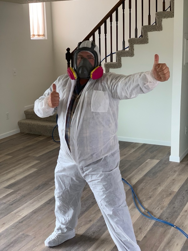 Pure Maintenance of Alaska certified technician in full protective equipment ready for mold treatment